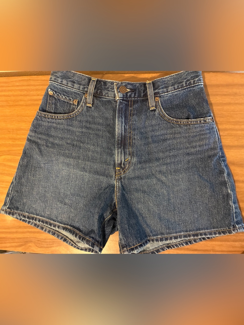 Levi’s mid thigh Cinch waist dark wash shorts
